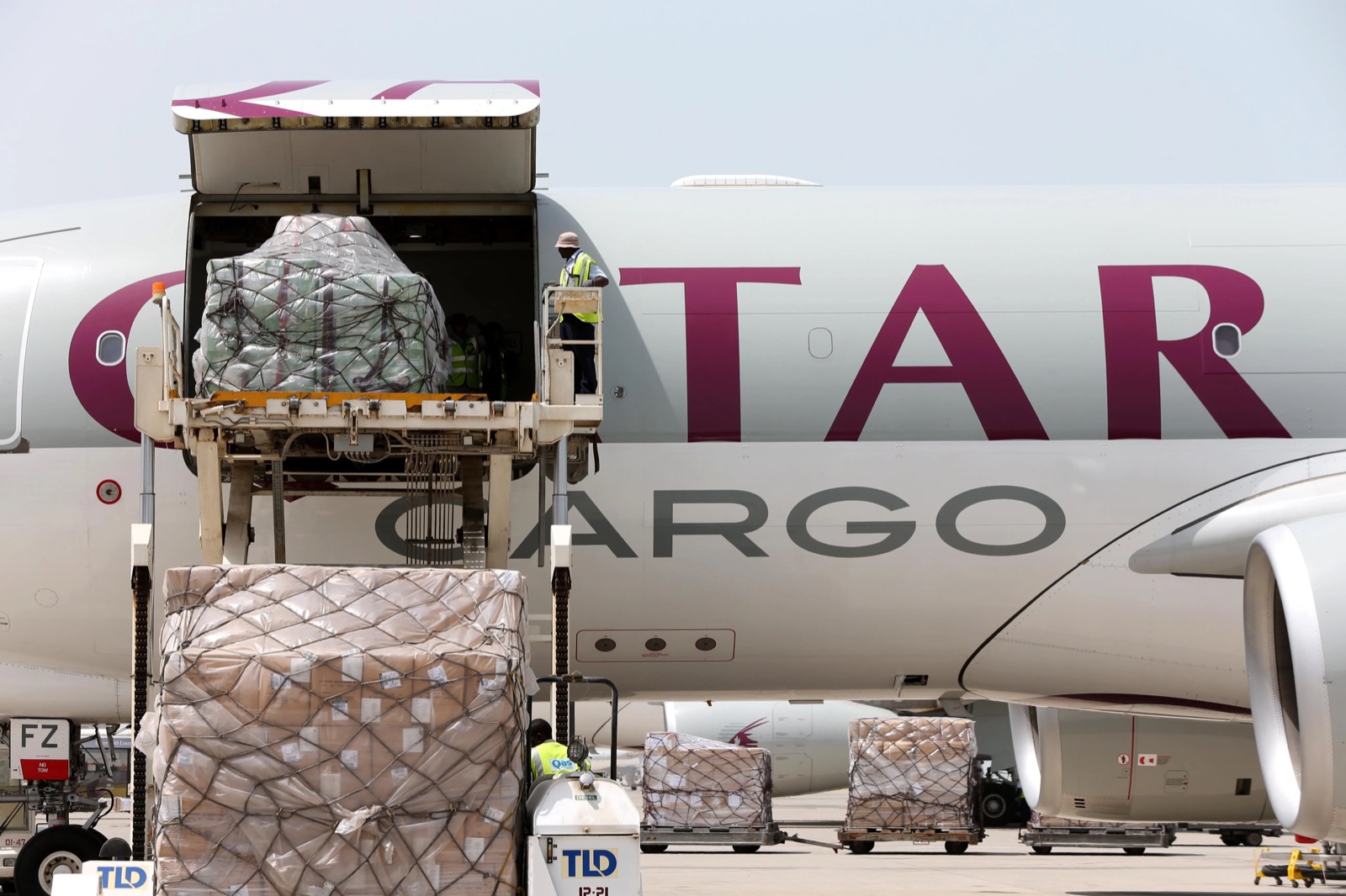 Cargo pallets being loaded onto a Qatar Airways Cargo aircraft