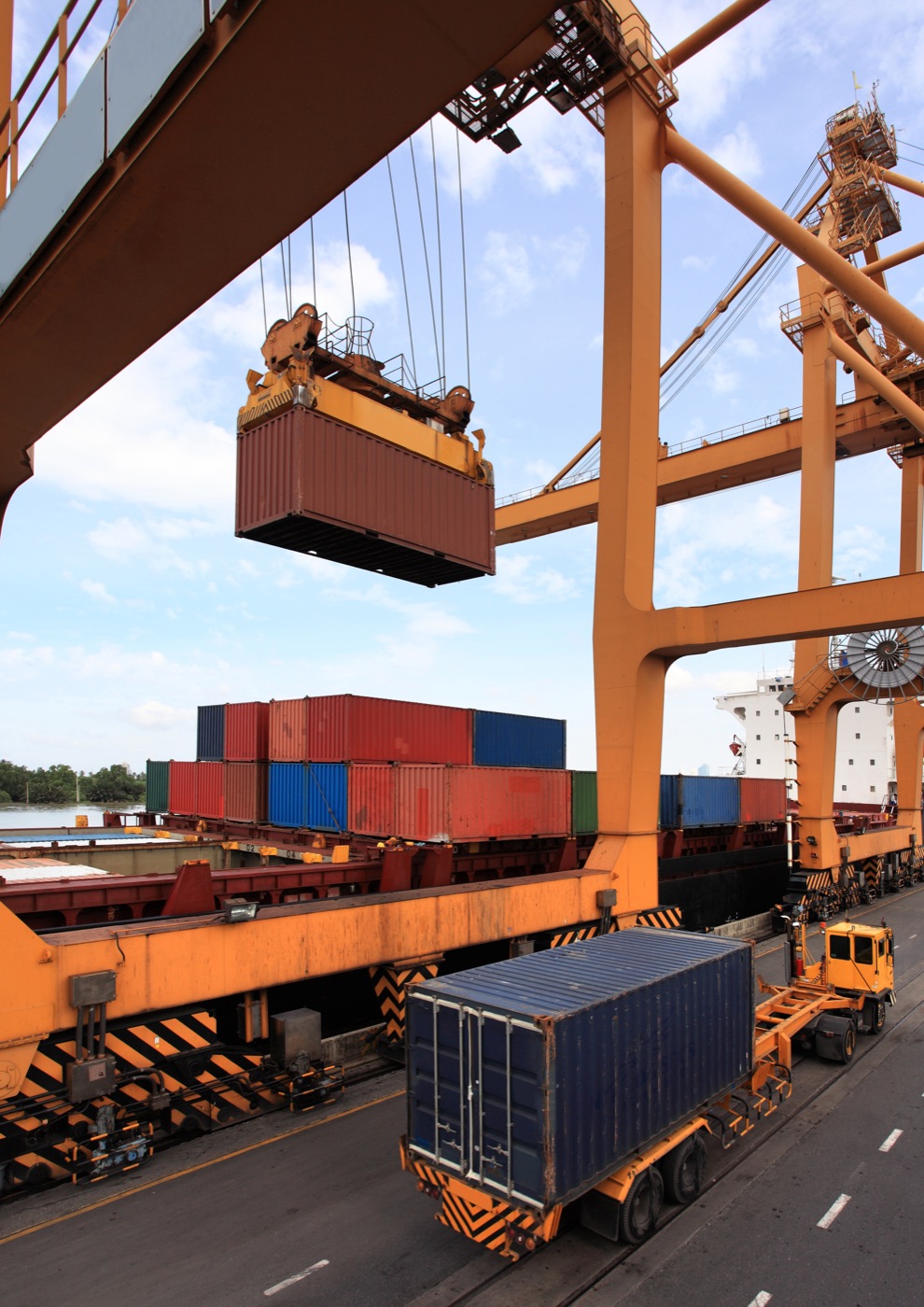 Gantry crane placing a container on a truck
